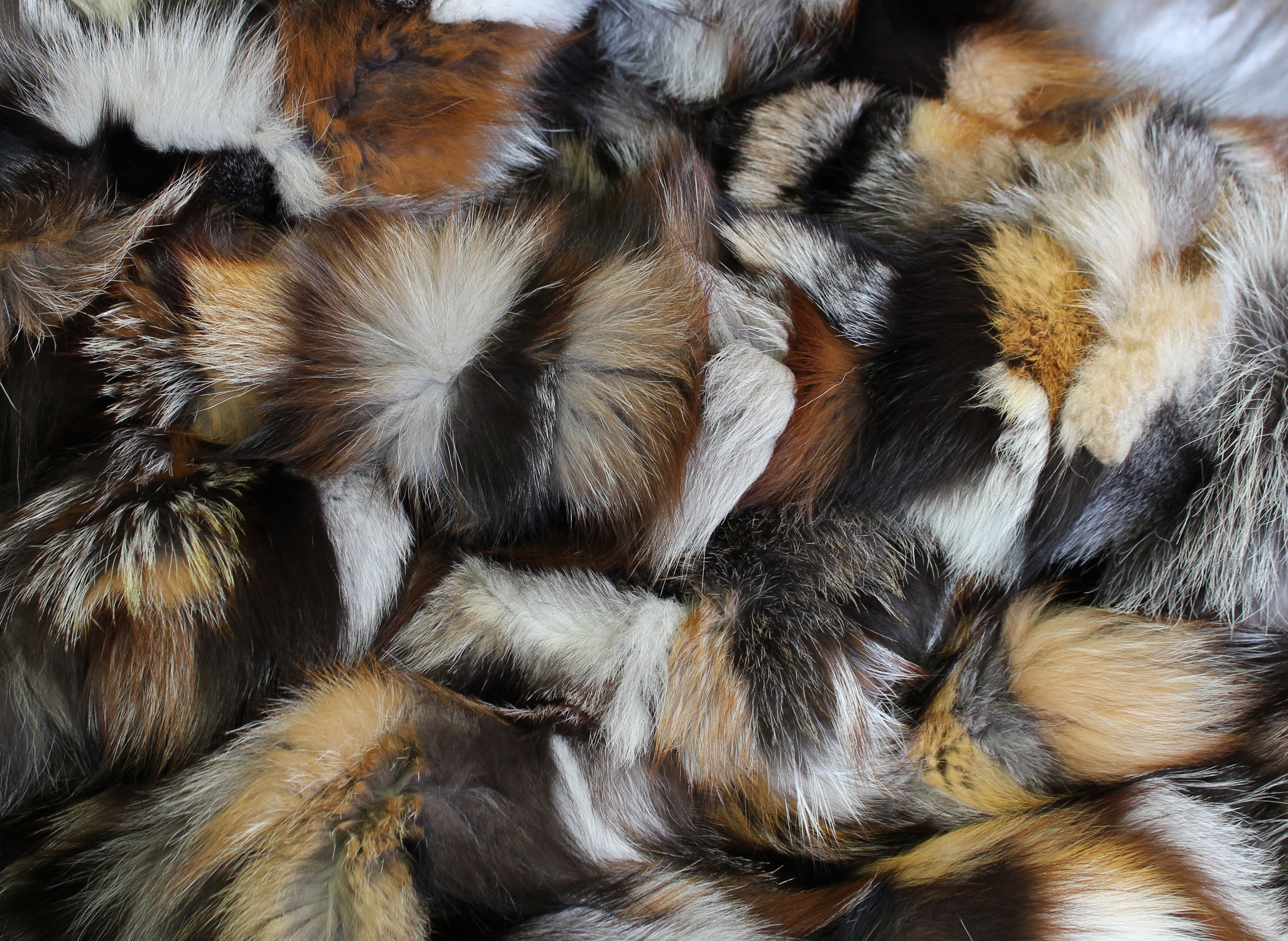Snug Fox Pieces Fur Blanket in various natural tones