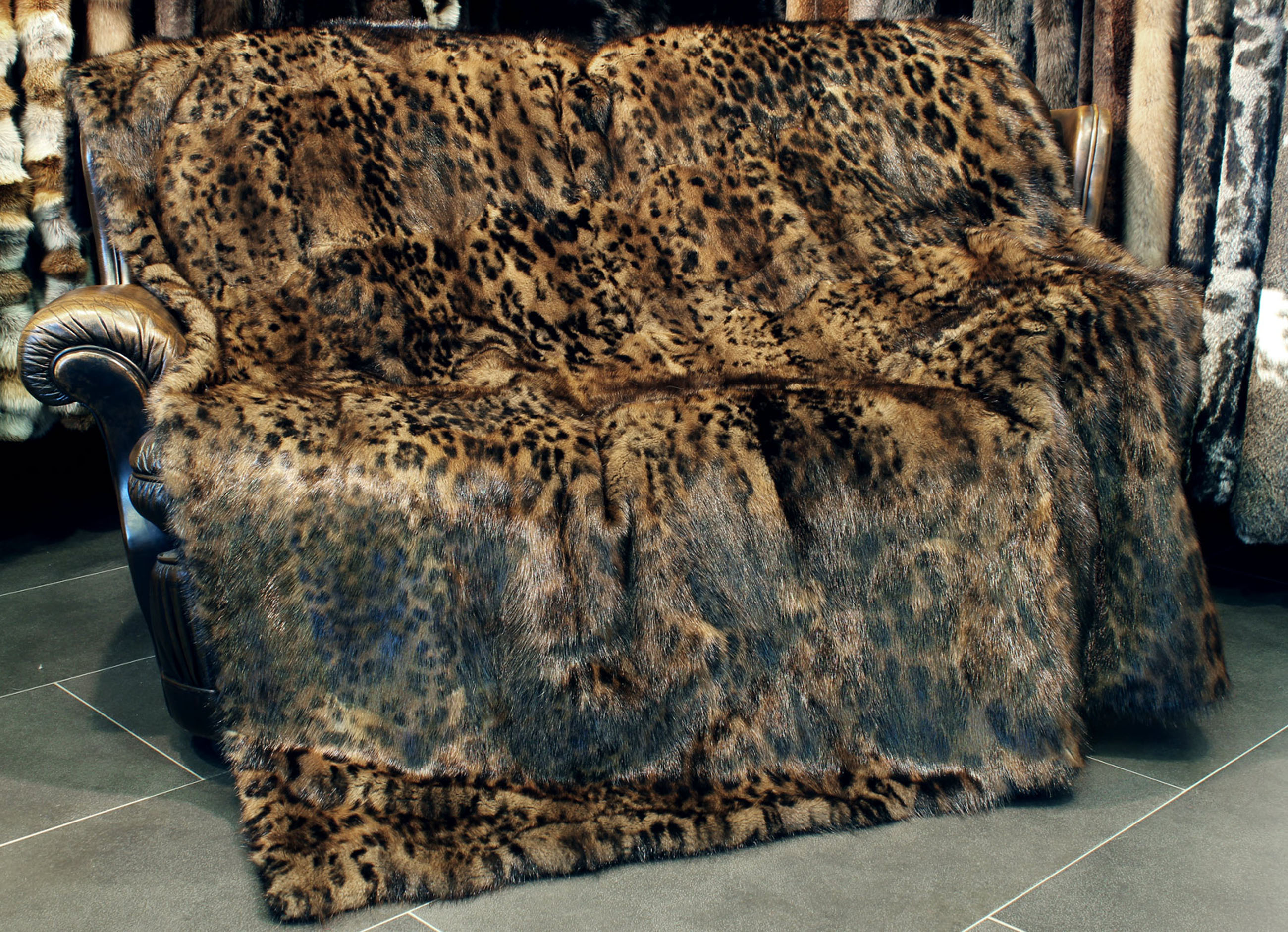 Musquash Fur Blanket in brown with catprint