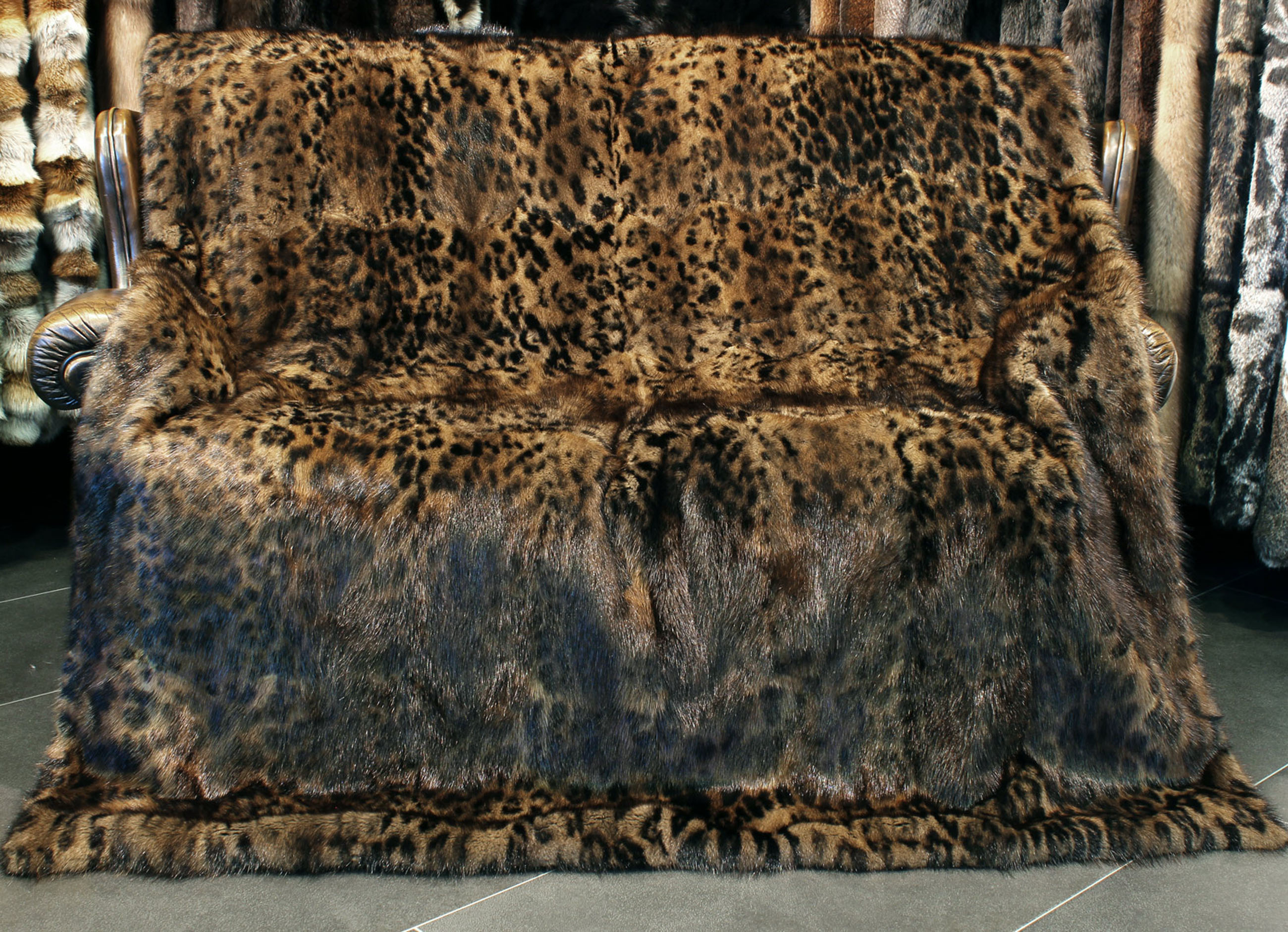 Musquash Fur Blanket in brown with catprint