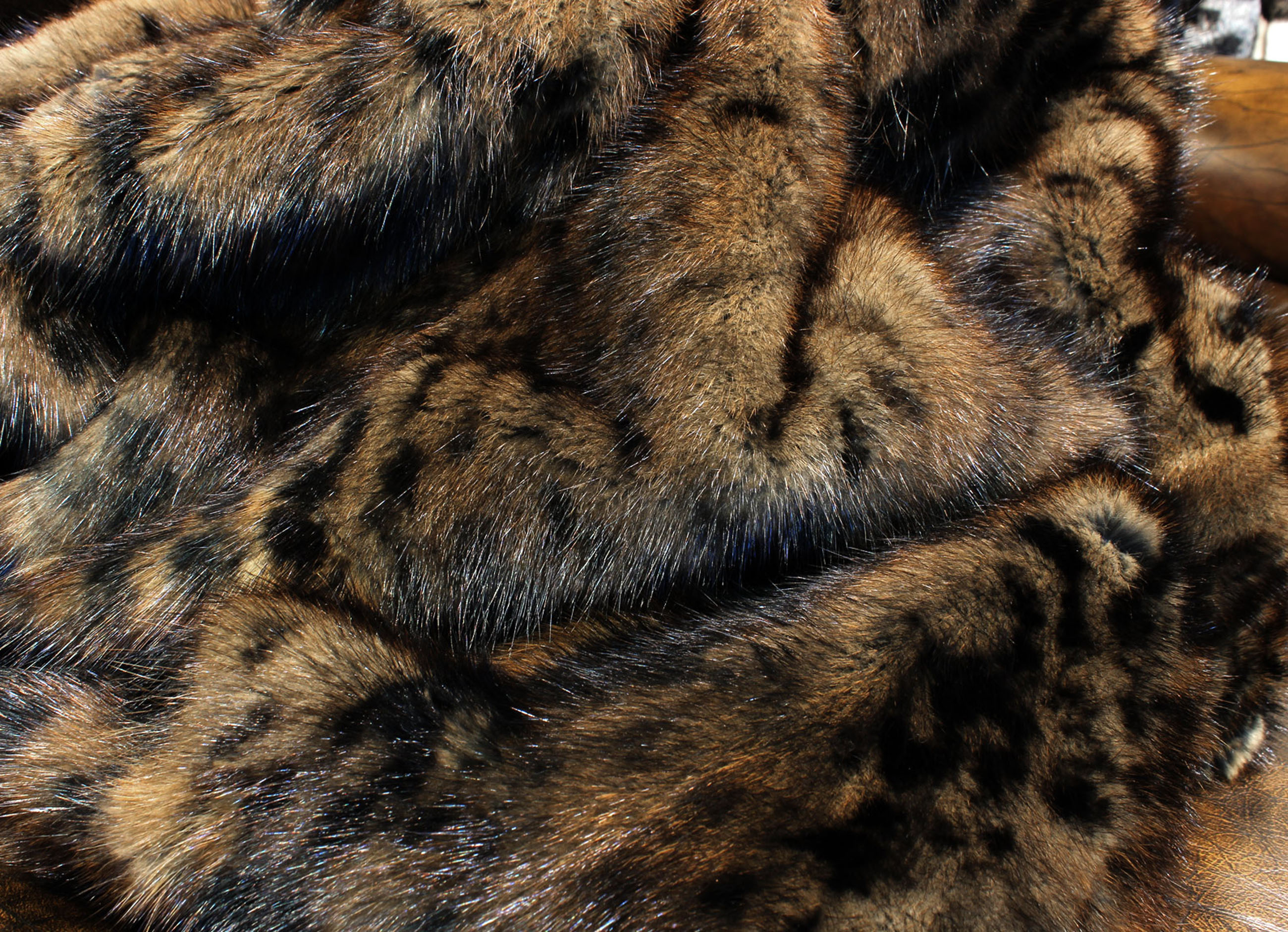 Musquash Fur Blanket in brown with catprint